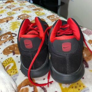 Red Nike tennis shoes